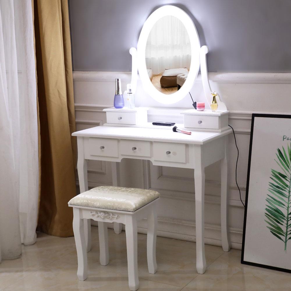 white vanity desk with mirror and lights